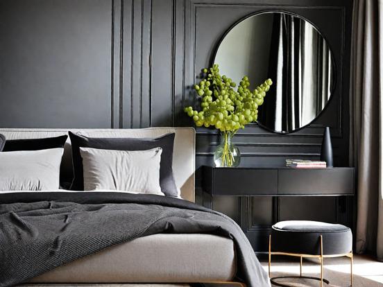 Dark serene bedroom with mirror