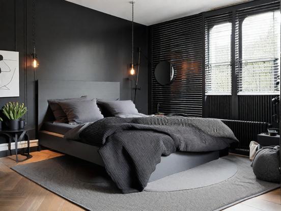 Dark bedroom with black wall