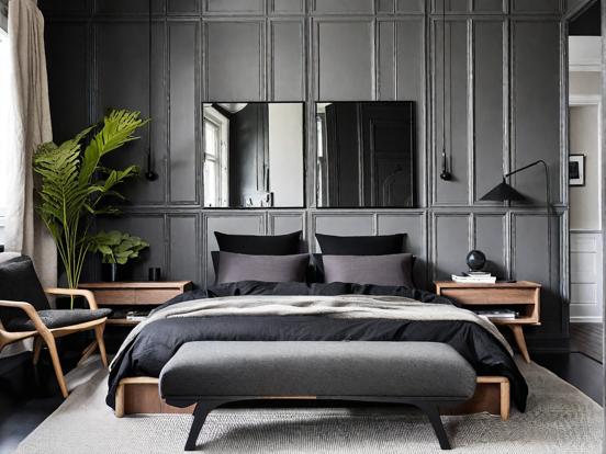 Dark moody bedroom with bed