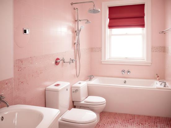 Pink bathroom with white toilet