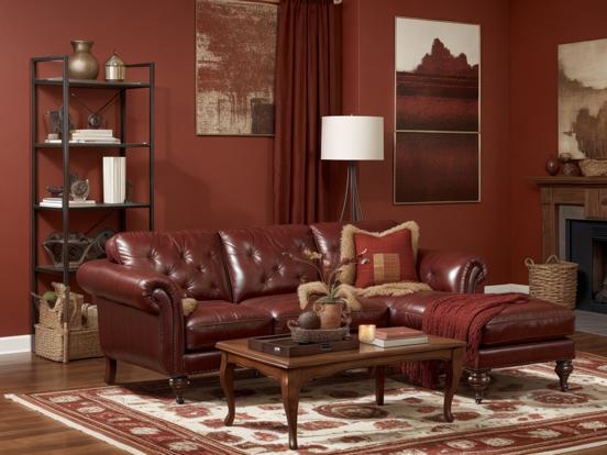 Red leather couch in cozy room