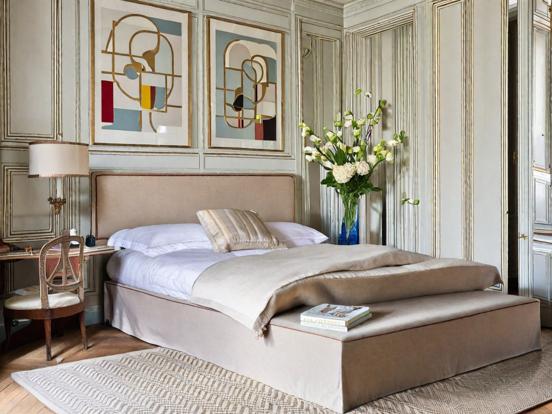 Serene bedroom with gold linens