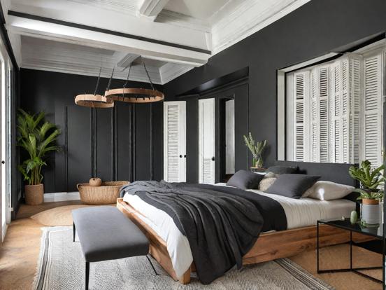 Dark cozy bedroom with bed