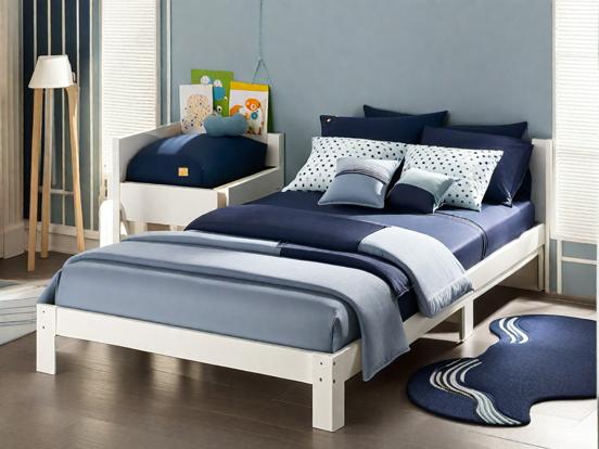 Blue comforter white frame bed