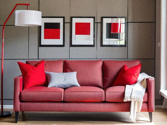 Red couch closeup with pillows