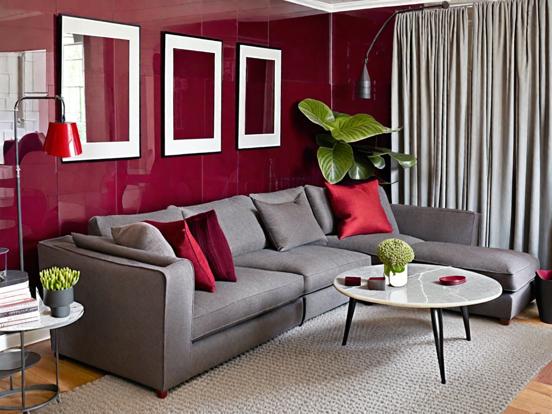 Gray couch red wall chic room