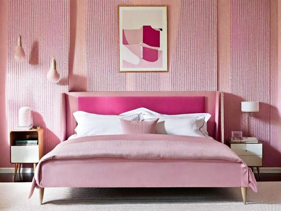 Pink bed and wall closeup