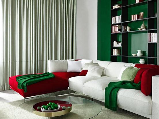 White couch red green pillows