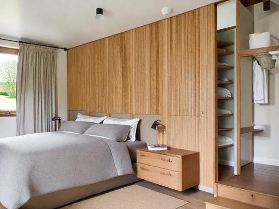 Serene wood paneled bedroom