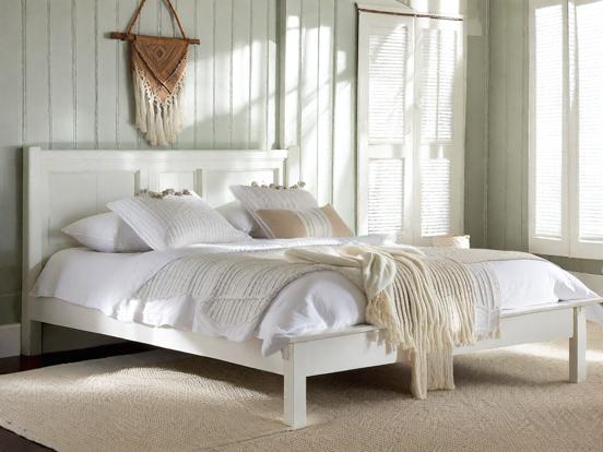 White serene bedroom with bed