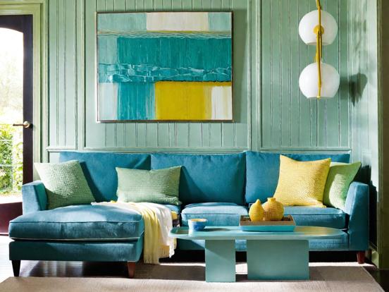 Teal couch in blue room