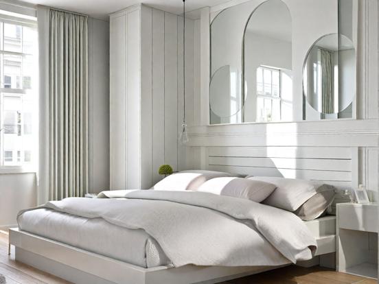 White serene bedroom with bed