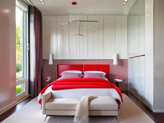 Red bedroom white bench bright