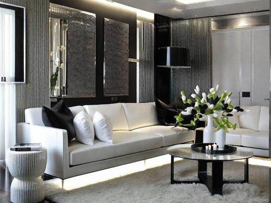 White couches black walls room