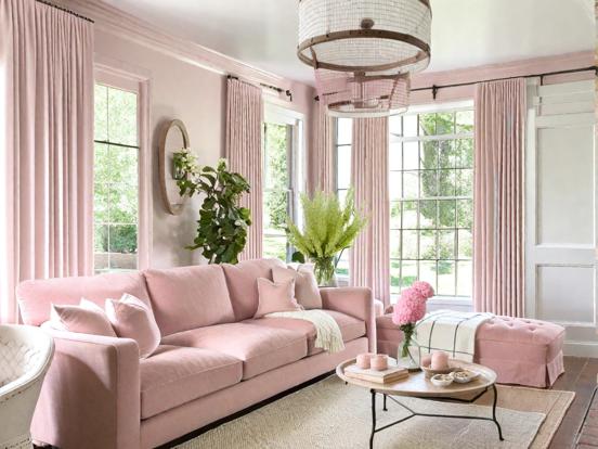 Pink couch white rug cozy room