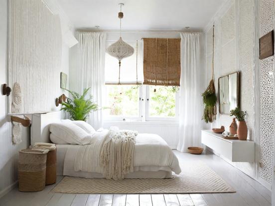 Closeup serene white boho bedroom