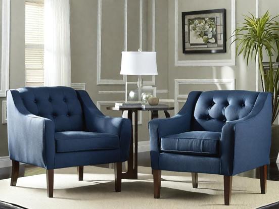 Two elegant blue armchairs lounge