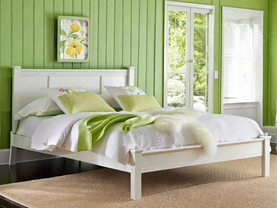 Green serene bedroom with bed