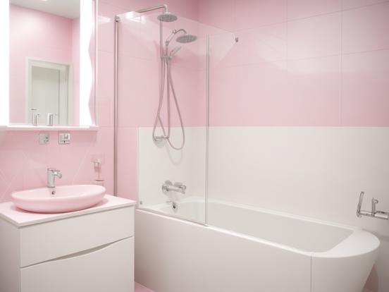 Pink bathroom white sink bathtub