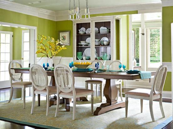 Green dining room table set flowers