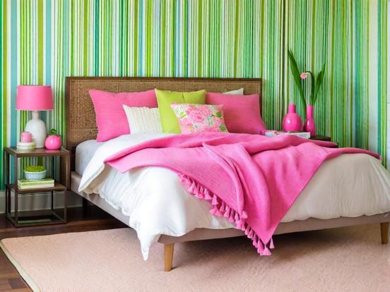 Closeup pink bed green wall