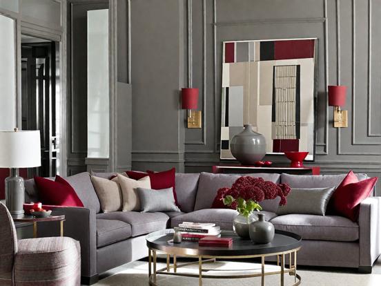 Gray couch red pillows chic room