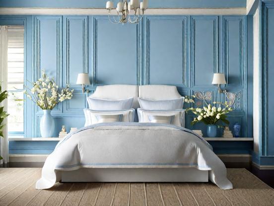 Closeup of blue white bed