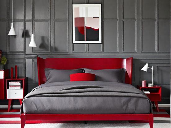 Red headboard gray bed closeup