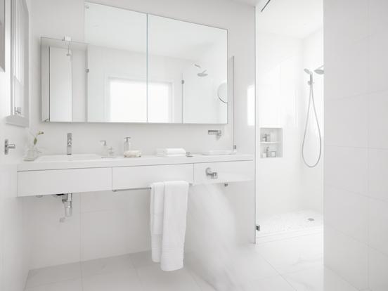 White bathroom large mirror shower