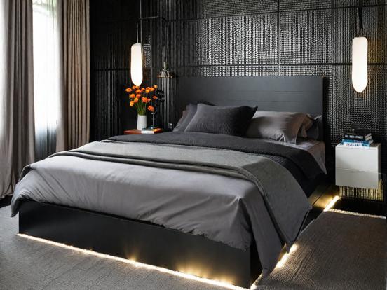 Dark bedroom with bed and lights