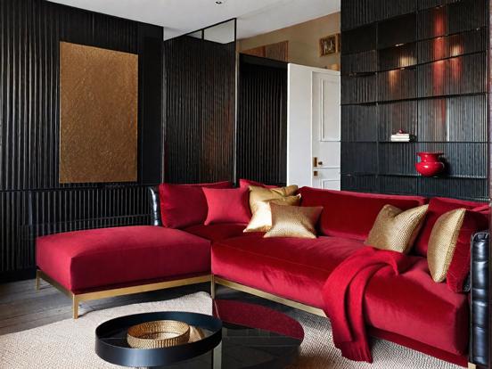 Red couch black wall living room